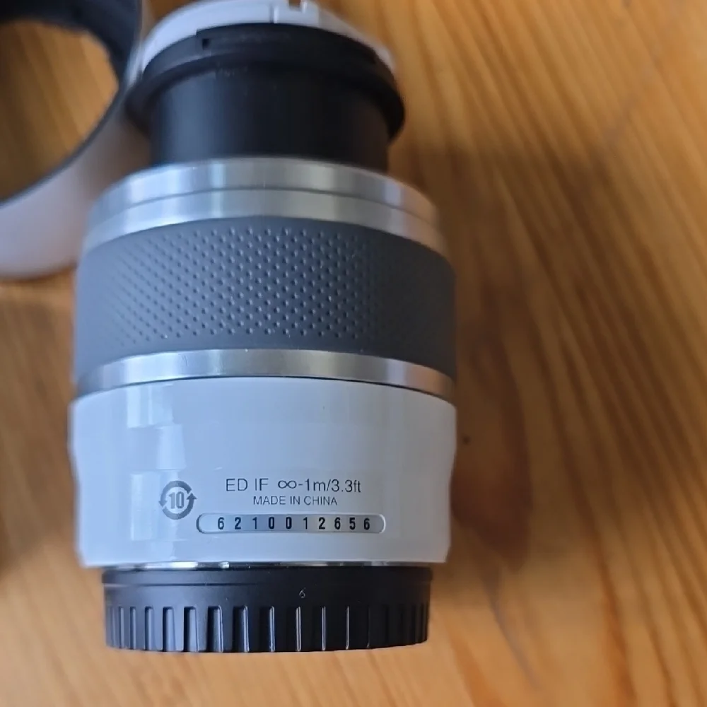 Compact Silver Camera with Accessories